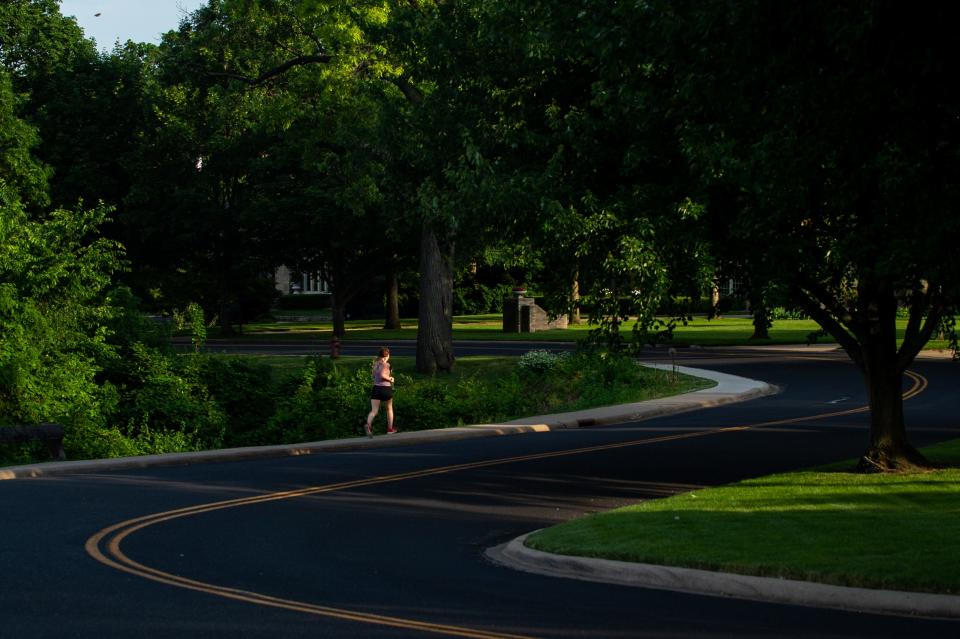 A runner gets their workout in on Grandview Drive in Peoria Heights on Sunday, June 6, 2021. Temperatures were in the upper 80s both days this weekend.