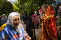 Christian Orthodox worshippers attend a service at Archangel Saint Michael monastery, in Odesa, Ukraine, Sunday, May 15, 2022. Almost three months after Russia shocked the world by invading Ukraine, its military faces a bogged-down war. (AP Photo/Francisco Seco)