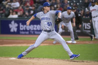 Kansas City Royals starting pitcher Brady Singer delivers against the Cleveland Guardians during the first inning of a baseball game in Cleveland, Friday, Sept. 30, 2022. (AP Photo/Phil Long)