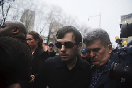 Martin Shkreli departs the U.S. Federal Court after an arraignment following him being charged in a federal indictment filed in Brooklyn, December 17, 2015. REUTERS/Lucas Jackson