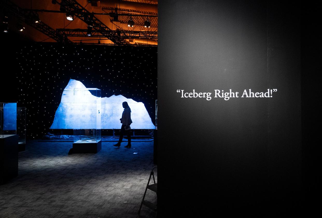 Mar 7, 2024; Columbus, OH, United States; A visitor walks by a cutout of an iceberg that is part of the new exhibit "Titanic: The Artifact Exhibition" at the Center of Science and Industry (COSI).