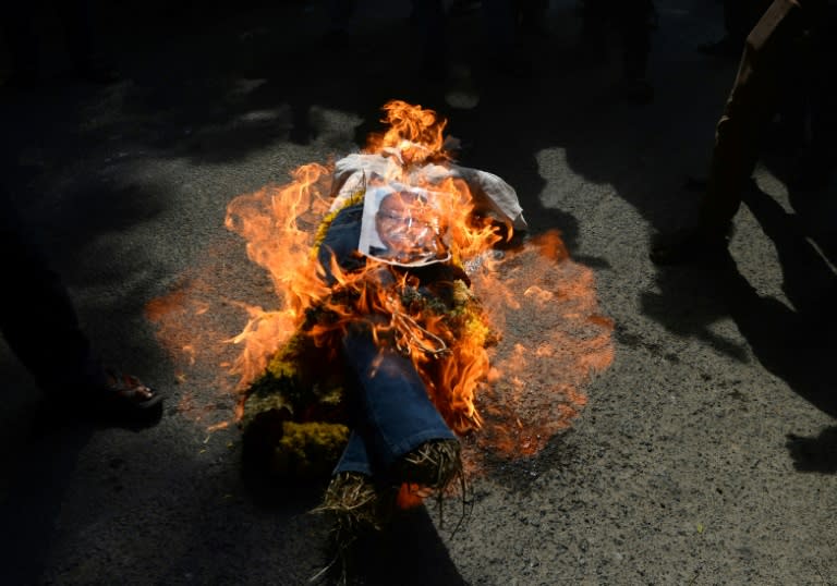 Indian protesters burn an effigy of Vedanta Resources boss Anil Agarwal at a protest in Chennai condemning the killings of protesters