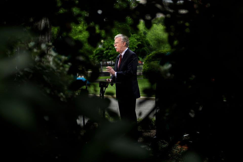 In this file photo taken on May 01, 2019, former National Security Advisor John Bolton speaks to Fox News outside the White House May 1, 2019, in Washington, DC.