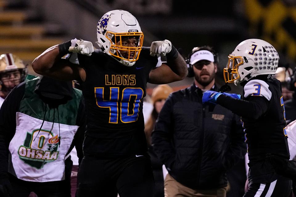 Nov 18, 2022; Columbus, Ohio, USA;  Gahanna's Isaiah Wills-Jackson (3) and Kamari Burns (40) celebrate a defensive stop during the first half of the high school football Div. I regional final against the New Albany Eagles at Historic Crew Stadium. Mandatory Credit: Adam Cairns-The Columbus Dispatch