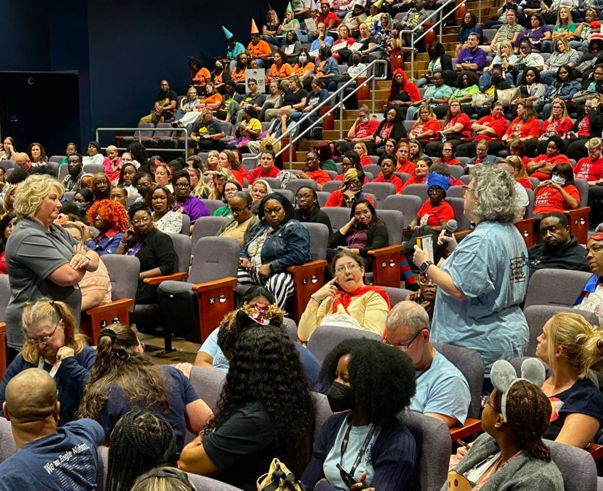 SCCPSS Director of Curriculum Programming Andrea Burkiett (left, standing) listens as a teacher shares thoughts after watching The Right to Read documentary during the district's Literacy Kickoff event on Friday Oct. 6, 2023 at Beach High School