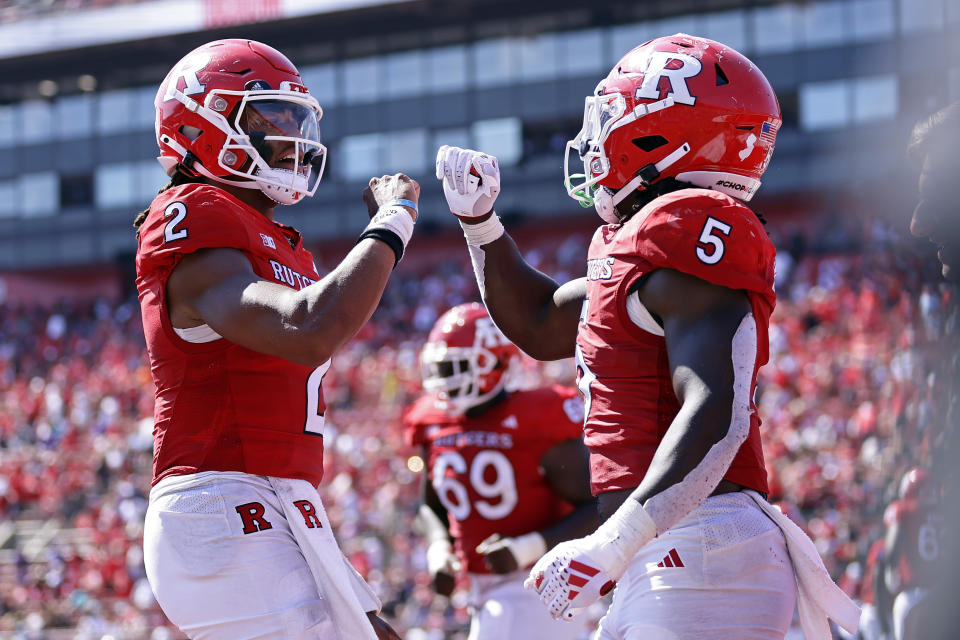 Rutgers running back Kyle Monangai (5) celebrates scoring a touchdown with Gavin Wimsatt (2) during the second half of an NCAA college football game, Sunday, Sept. 3, 2023, in Piscataway, N.J. (AP Photo/Adam Hunger)