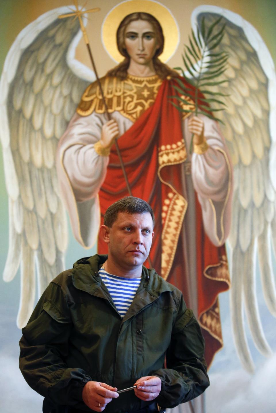 Alexander Zakharchenko, separatist leader of the self-proclaimed Donetsk People's Republic, looks on at the temple of Archangel Michael during his visit to Makeevskiy coking plant in Makiivka, outside Donetsk, October 29, 2014. Ukraine on Tuesday condemned as "destructive and provocative" Russia's stance towards elections organised by pro-Russian separatists in eastern Ukraine next Sunday, saying Moscow's recognition of the vote could wreck chances of bringing peace. REUTERS/Maxim Zmeyev (RUSSIAPOLITICS ELECTIONS - Tags: POLITICS RELIGION CIVIL UNREST ELECTIONS)