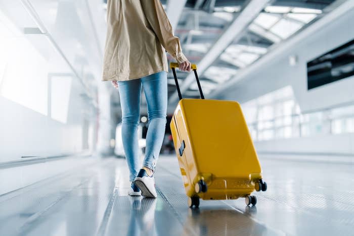 woman walking with luggage