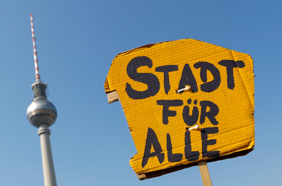 A placard reading "City for all" is pictured with the TV tower in the background during a protest against rising rents and a housing shortage in Berlin, Germany April 6, 2019. REUTERS/Fabrizio Bensch