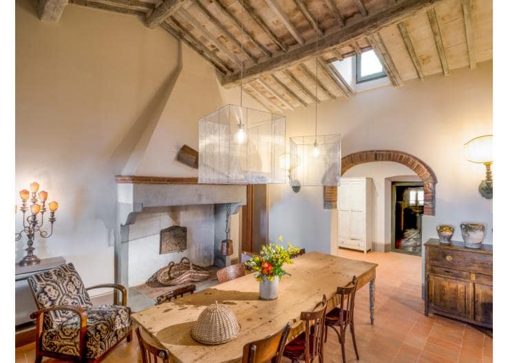 The attractive kitchen on the ground floor has high ceilings - but you may prefer to eat outside - Credit: Villa I Gigli; Oliver's Travels