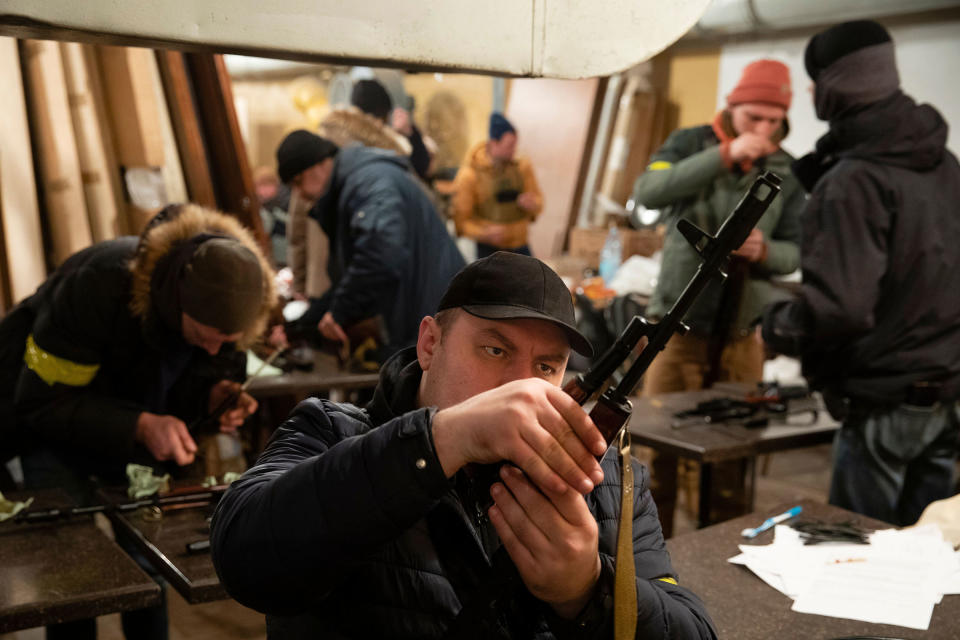 Territorial​ Defense Forces members prepare to patrol in Kyiv on Feb. 28.<span class="copyright">Mikhail Palinchak—EPA-EFE/Shutterstock</span>