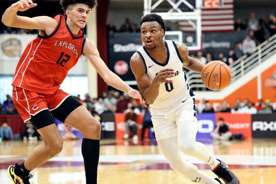 Bronny James drives against Christopher Columbus at the high school Hoophall Classic in January in Springfield, Mass. Bronny, the son of NBA superstar LeBron James, went into cardiac arrest Monday during a University of Southern California basketball practice.