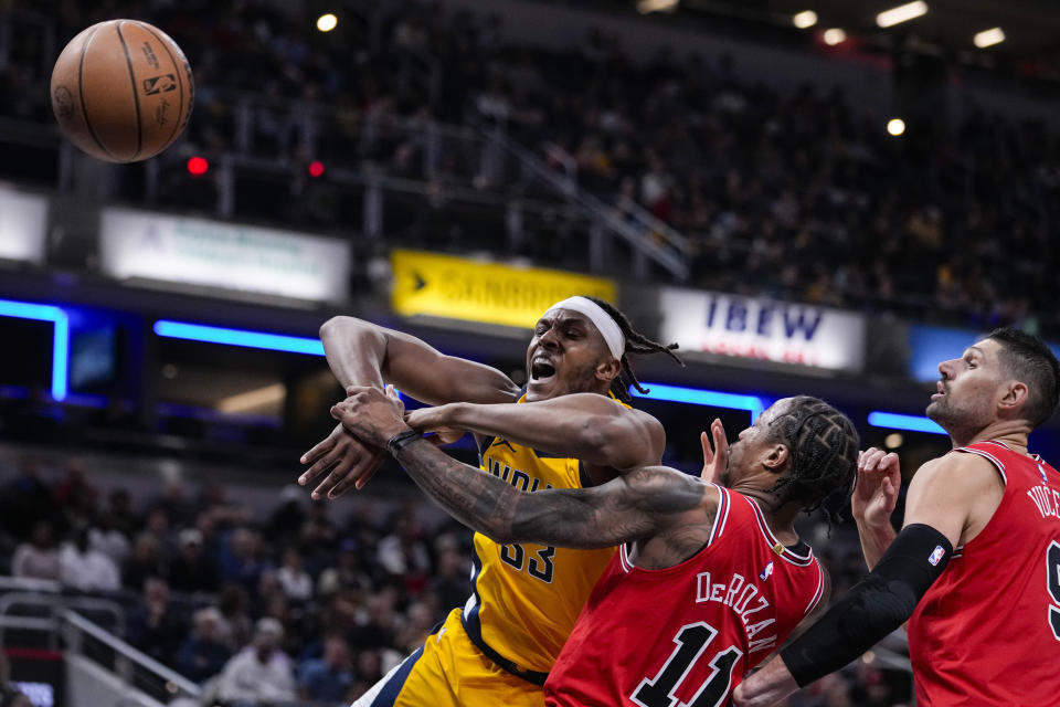 Indiana Pacers center Myles Turner (33) looses the ball after being fouled by Chicago Bulls forward DeMar DeRozan (11) during the first half of an NBA basketball game in Indianapolis, Monday, Oct. 30, 2023. (AP Photo/Michael Conroy)