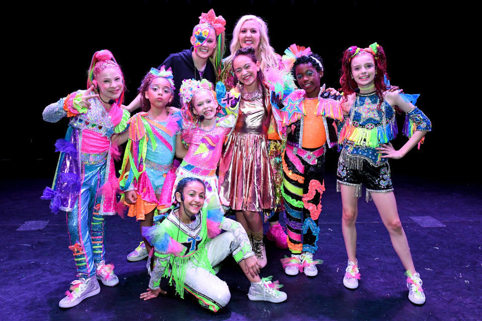 SIWAS DANCE POP REVOLUTION -- "Introducing, XOMG POP!" Episode 108 -- Pictured: (l-r) Kiya Barczyszyn, Dallas Skye, JoJo Siwa, Kinley Cunningham, Bella Cianni Llerena, Brooklyn Pitts, Leigha Rose Sanderson -- (Photo by: Aaron Poole/Peacock/NBCU Photo Bank via Getty Images)