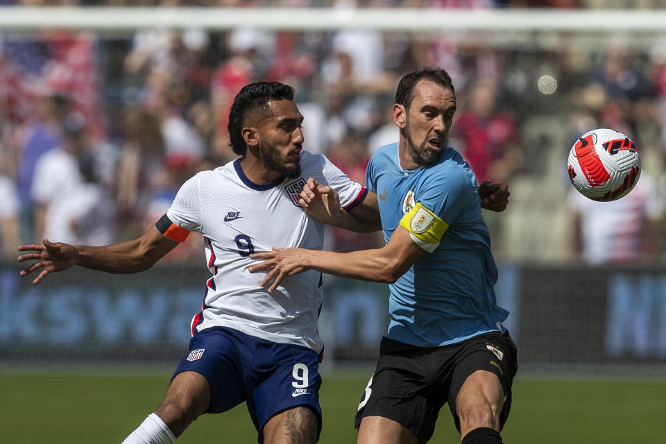 KANSAS CITY, KS - JUNE 05:   United States forward Jesus Ferreira (9) chases down Uruguay defender Diego Godin (3) during the match between the USMNT and Uruguay on Sunday June 5th, 2022 at Childrens Mercy Park in Kansas City, KS.  (Photo by Nick Tre. Smith/Icon Sportswire via Getty Images)