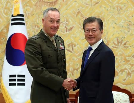 South Korean President Moon Jae-in shakes hands with U.S. Chairman of the Joint Chiefs of Staff Gen. Joseph Dunford during their meeting at the Presidential Blue House in Seoul, South Korea, August 14, 2017. Bae Jae-man/Yonhap via REUTERS