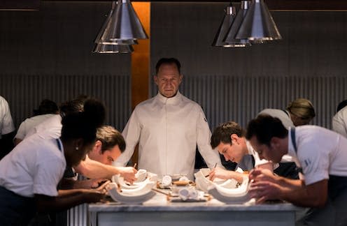 <span class="caption">Ralph Fiennes (centre) plays The Menu’s mad Chef Slowick.</span> <span class="attribution"><span class="source">Disney</span>, <span class="license">Author provided</span></span>