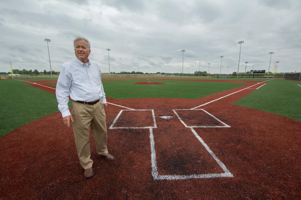 Westfield Mayor Andy Cook stands near home plate on the championship baseball field at the 400-acre Grand Park sports complex, June 10, 2014.