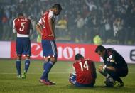 Paraguay players react after Argentina's Gonzalo Higuain (not pictured) scored a goal during their Copa America 2015 semi-final soccer match at Estadio Municipal Alcaldesa Ester Roa Rebolledo in Concepcion, Chile, June 30, 2015. REUTERS/Carlos Garcia Rawlins