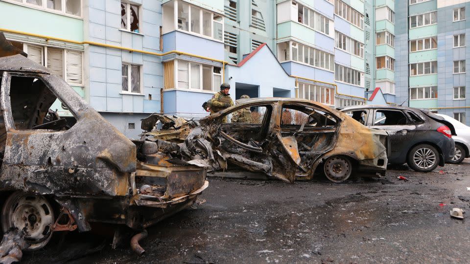 Self-defense unit volunteers stand by burned-out cars in a residential area of the city of Belgorod, Russia, following fresh aerial attacks on March 22, 2024. - AFP/Getty Images