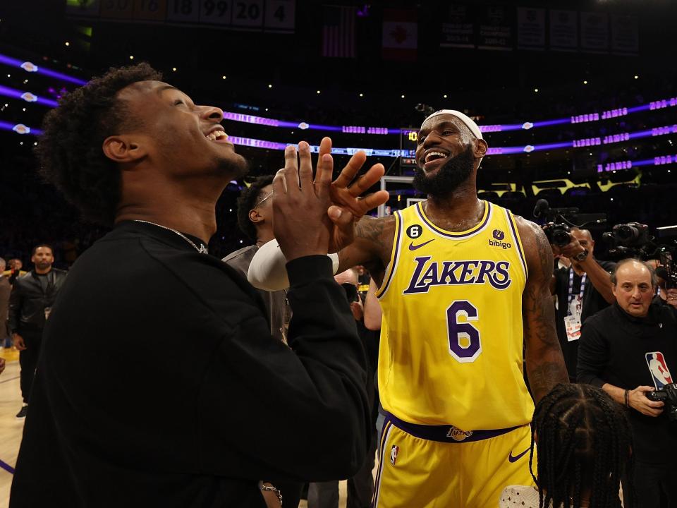 LeBron James #6 of the Los Angeles Lakers reacts with Bronny James after scoring to pass Kareem Abdul-Jabbar to become the NBA's all-time leading scorer, surpassing Abdul-Jabbar's career total of 38,387 points against the Oklahoma City Thunder at Crypto.com Arena on February 07, 2023