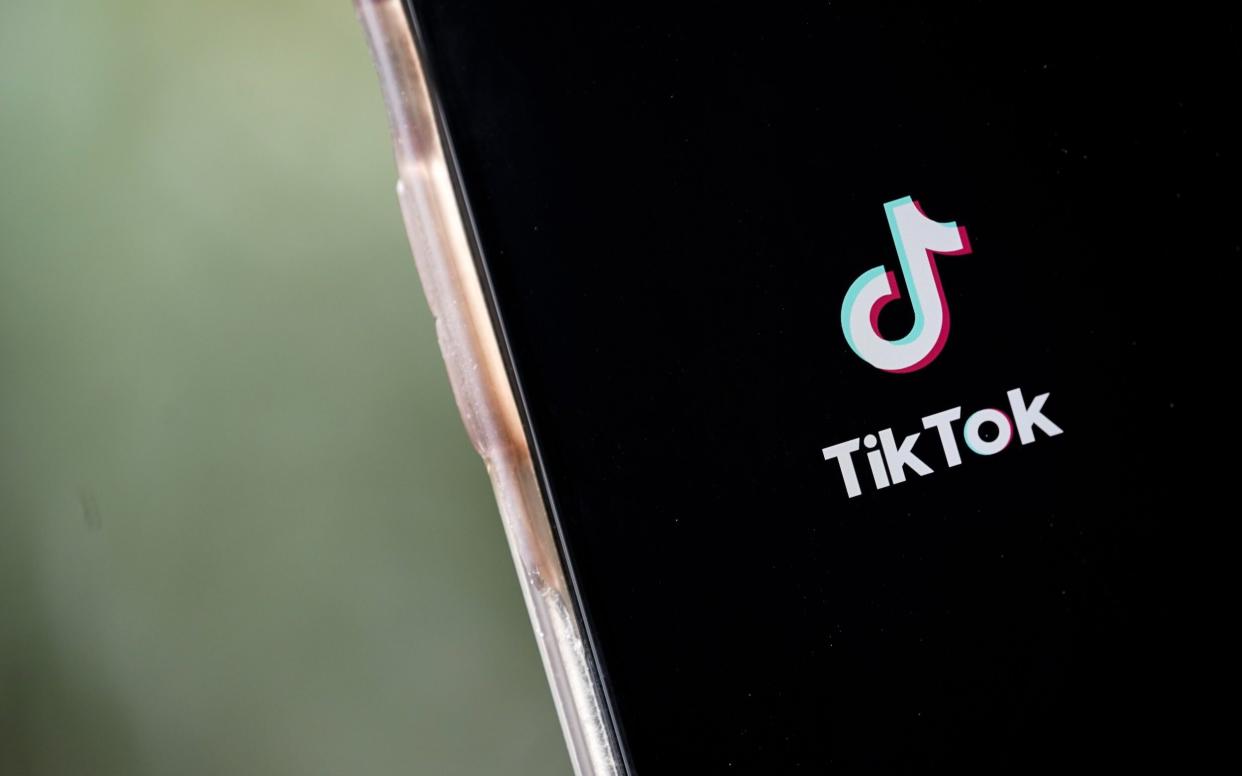 The TikTok logo on a smartphone screen