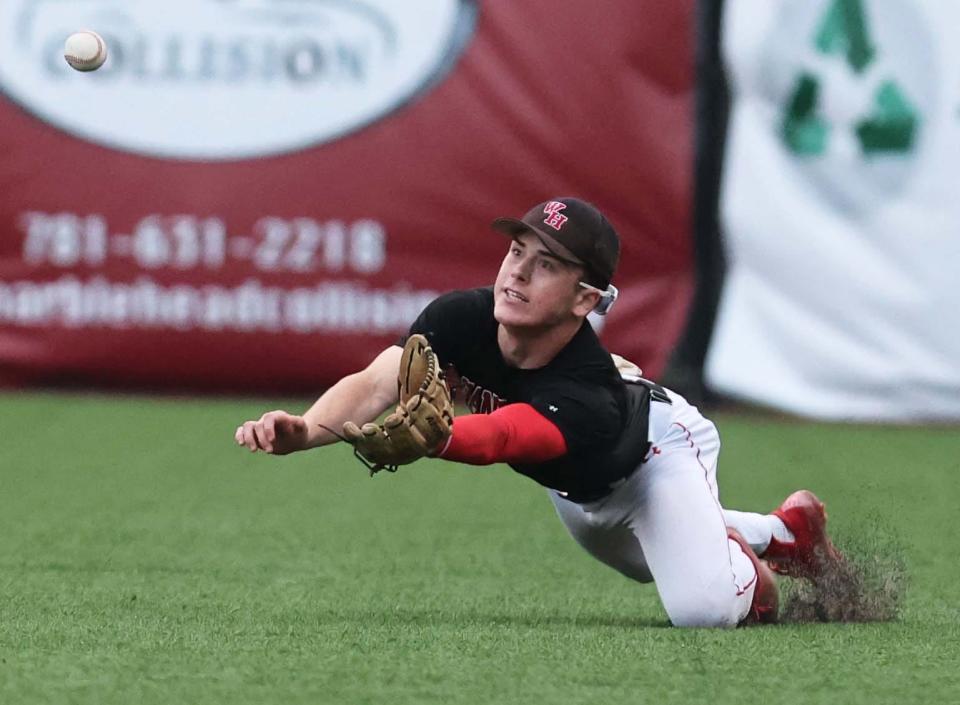 Whitman-Hanson right fielder Braden Kain makes the diving catch during a game versus Milton at Fraser Field in Lynn on Tuesday, June 13, 2023.