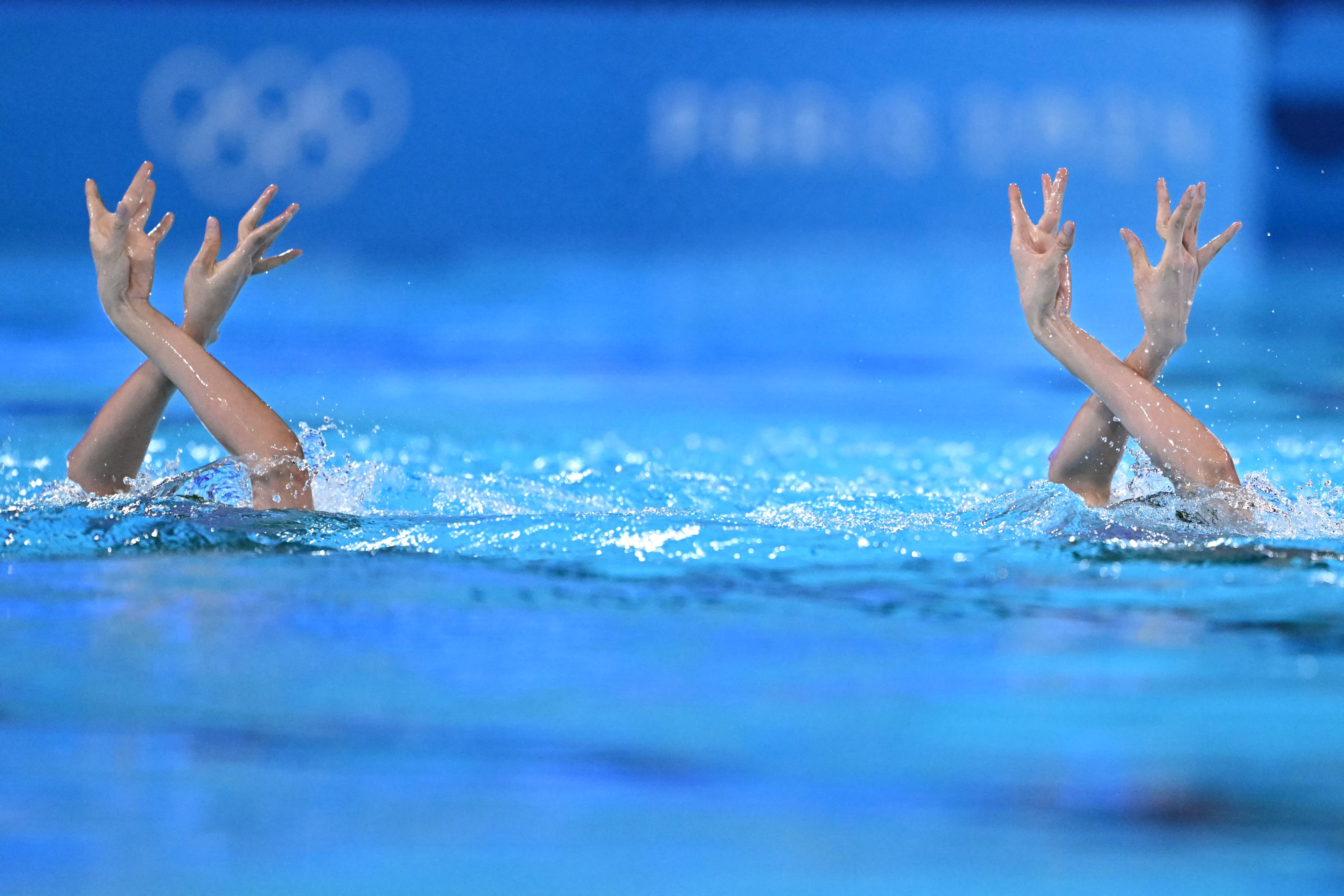 China's Wang Liuyi and China's Wang Qianyi compete in the duet technical routine of the artistic swimming event during the Paris 2024 Olympic Games at the Aquatics Centre in Saint-Denis, north of Paris, on August 9, 2024. (Manan Vatsyayana/AFP/Getty Images) 