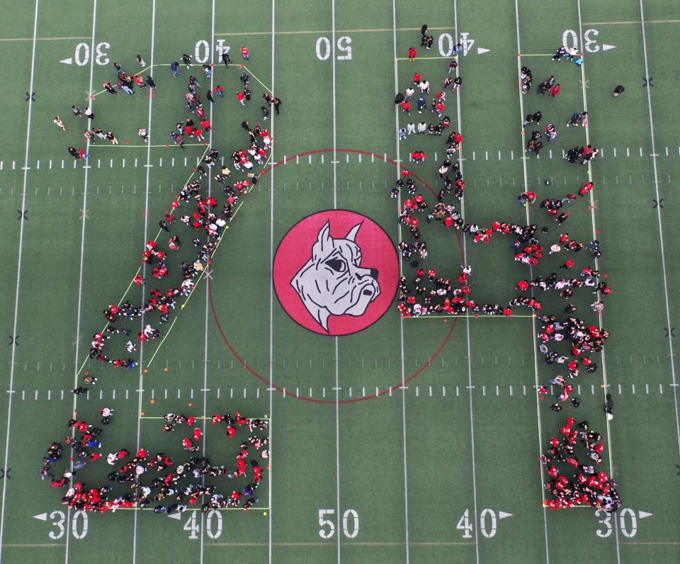 Brockton High School's Class of 2024 poses for yearbook photo at Rocky Marciano Stadium on Friday, Oct, 20, 2023. Approximately 700 students is the largest senior class in New England.
