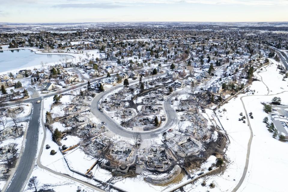 In several neighborhoods, the fire left homes standing next door to burned structures. <a href="https://www.gettyimages.com/detail/news-photo/in-this-aerial-view-burned-homes-sit-in-a-neighborhood-news-photo/1237535531" rel="nofollow noopener" target="_blank" data-ylk="slk:Michael Ciaglo/Getty Images;elm:context_link;itc:0;sec:content-canvas" class="link ">Michael Ciaglo/Getty Images</a>