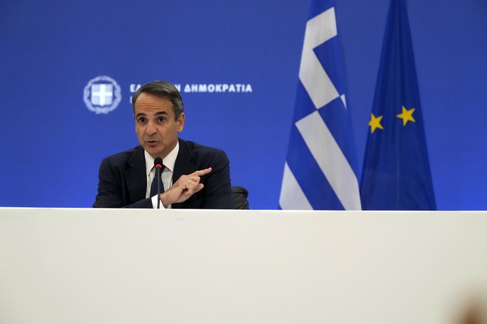 Greece's Prime Minister Kyriakos Mitsotakis speaks during a press conference in Athens, Thursday, Aug. 12, 2021. Mitsotakis says the devastating wildfires that burnt across the country over more than a week have caused the greatest ecological catastrophe Greece has seen in decades. (AP Photo/Thanassis Stavrakis)