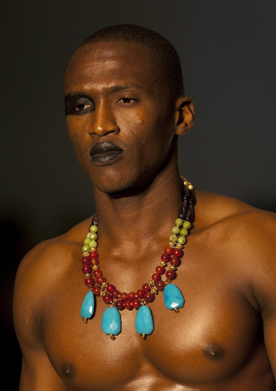 A model wears a creation by Haitian jewelry designer Savannah Savary during Fashion Week in Port-au-Prince, Haiti, late Sunday, Nov. 11, 2012. (AP Photo/Dieu Nalio Chery)