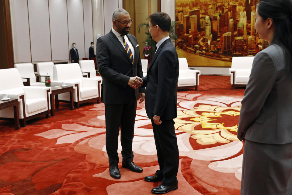 British Foreign Secretary James Cleverly, left, and Chinese Vice President Han Zheng shake hands before a meeting at the Great Hall of the People in Beijing, China Wednesday, Aug. 30, 2023. (Florence Lo/Pool Photo via AP)