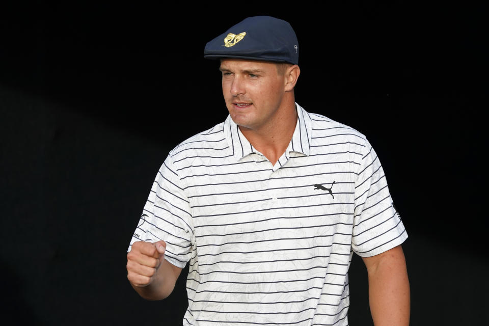 Bryson DeChambeau gestures to a young fan on the 15th hole during the third round of The Players Championship golf tournament Saturday, March 13, 2021, in Ponte Vedra Beach, Fla. (AP Photo/John Raoux)