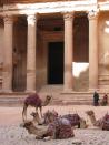 This April 23, 2016 photo shows camels in front of the Treasury building in Petra, the ancient rock-hewn city that is Jordan's blockbuster destination. This Middle Eastern country delivers a blockbuster list of iconic ancient monuments, otherworldly landscapes and warmhearted hospitality, with Petra as its tourism jewel. (Giovanna Dell'Orto via AP)