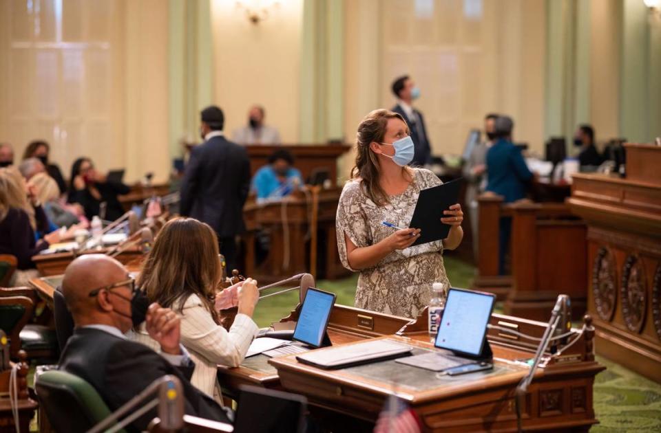 Assemblywoman Buffy Wicks, D-Oakland, looks up during a vote on the last day of the California Legislature’s 2021 legislative session at the Capitol in Sacramento. Wicks is in favor of CEQA reform and has authored bills allowing some housing developments to bypass the law's requirements entirely.