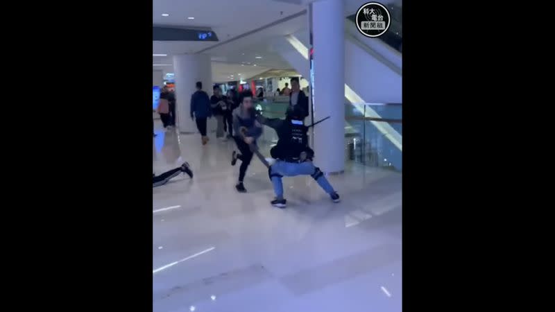 A man tries to evade police at Yuen Long mall in Hong Kong