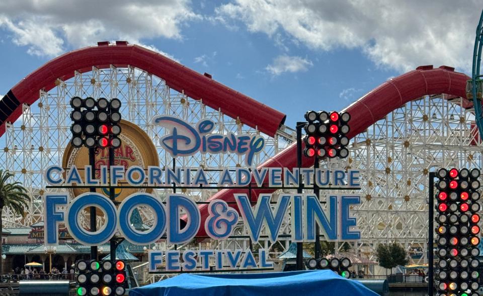 Stage at Disney California Adventure Food & Wine Festival with covered equipment in front