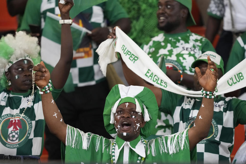 Fans cheer prior the start of the African Cup of Nations Round of 16 soccer match between Nigeria and Cameroon, at the Felix Houphouet Boigny stadium in Abidjan, Ivory Coast, Saturday, Jan. 27, 2024. 2024. (AP Photo/Sunday Alamba)