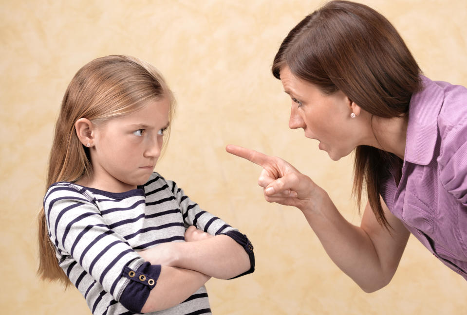 A mother scolding her daughter