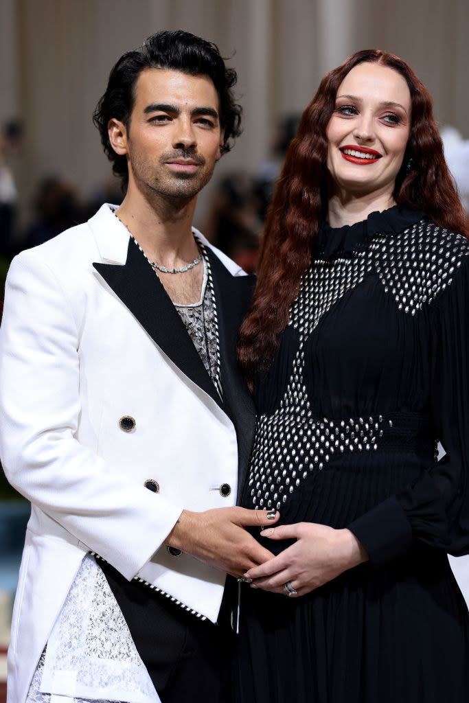 Joe Jonas puts his hand on Sophie Turner's stomach