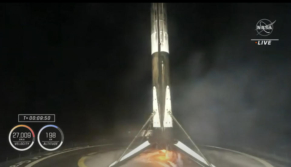 The SpaceX Falcon 9 rocket booster for the Crew-4 astronaut mission stands atop a drone ship after a successful landing on April 27, 2022.