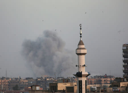 Smoke rises from Yarmouk Palestinian camp in Damascus, Syria April 19, 2018. REUTERS/Ali Hashisho