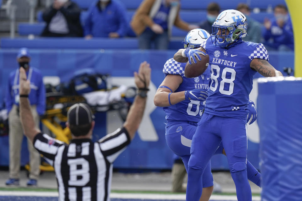 Kentucky tight end Keaton Upshaw (88) and tight end Justin Rigg (83) celebrate after Upshaw scored a touchdown during the first half of an NCAA college football game against Vanderbilt, Saturday, Nov. 14, 2020, in Lexington, Ky. (AP Photo/Bryan Woolston)