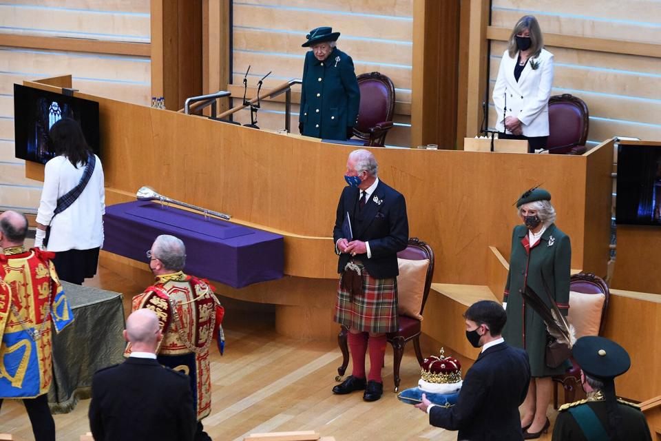 Britain's Queen Elizabeth II (C), with Britain's Prince Charles, Prince of Wales (2R) and Britain's Camilla, Duchess of Cornwall (R) prepares to make her Address to Parliament in the Debating Chamber during the opening of the sixth session of the Scottish Parliament in Edinburgh, Scotland on October 2, 2021.