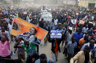 <p>Supporters of Kenyan opposition leader Raila Odinga of the National Super Alliance (NASA) coalition carry banners as they welcome Odinga’s return in Nairobi, Kenya, Nov. 17, 2017. (Photo: Baz Ratner/Reuters) </p>