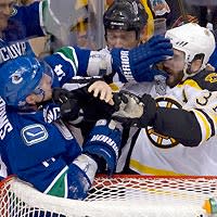 The alleged biting incident occurred when Alex Burrows (L) and Patrice Bergeron mixed it up