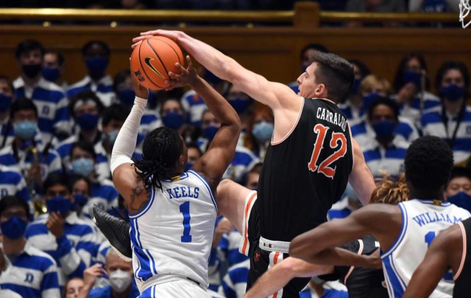 Duke guard Trevor Keels (1) has his shot blocked by Campbell forward Jesus Carralero (12) during the first half at Cameron Indoor Stadium in Durham, North Carolina, on Nov. 13, 2021.