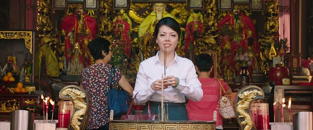 Mrs Wong (Audrey Luo) offers prayers. (Cathay-Keris Films)