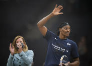 FILE - Minnesota Lynx center Sylvia Fowles waves to the crowd after WNBA commissioner Cathy Engelbert presented her with the trophy for being named WNBA Defensive Player of the Year, at a WNBA basketball game between the Lynx and Chicago Sky, Sunday, Sept. 26, 2021, in Minneapolis. One of the league's greatest centers is ready to move on to another career in mortuary science, no longer possessing the energy to stay in basketball shape. (Jeff Wheeler/Star Tribune via AP, File)